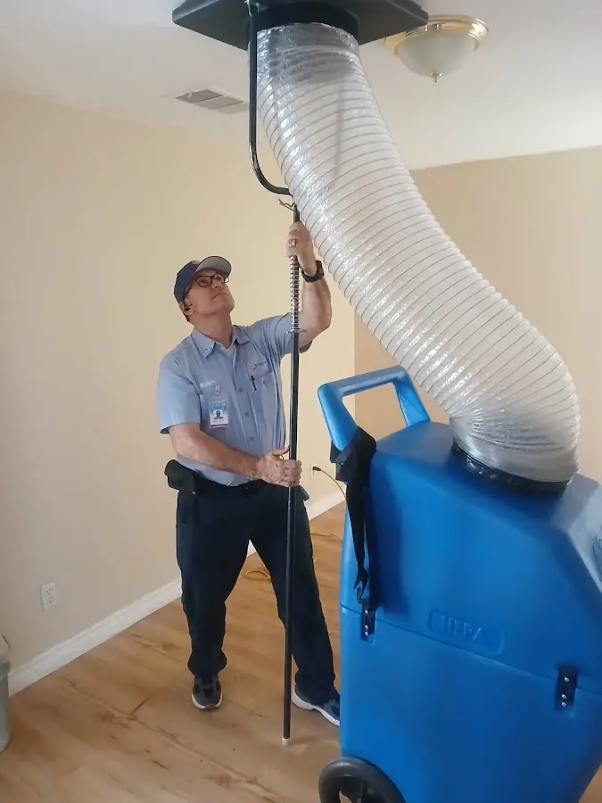 Furnace Tune-Up technician using HEPA equipment in West Hollywood